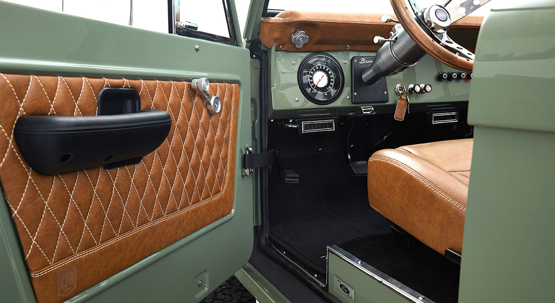 1973 Classic Ford Broncos Coyote Series in Boxwood Green with Whiskey interior and family roll cage