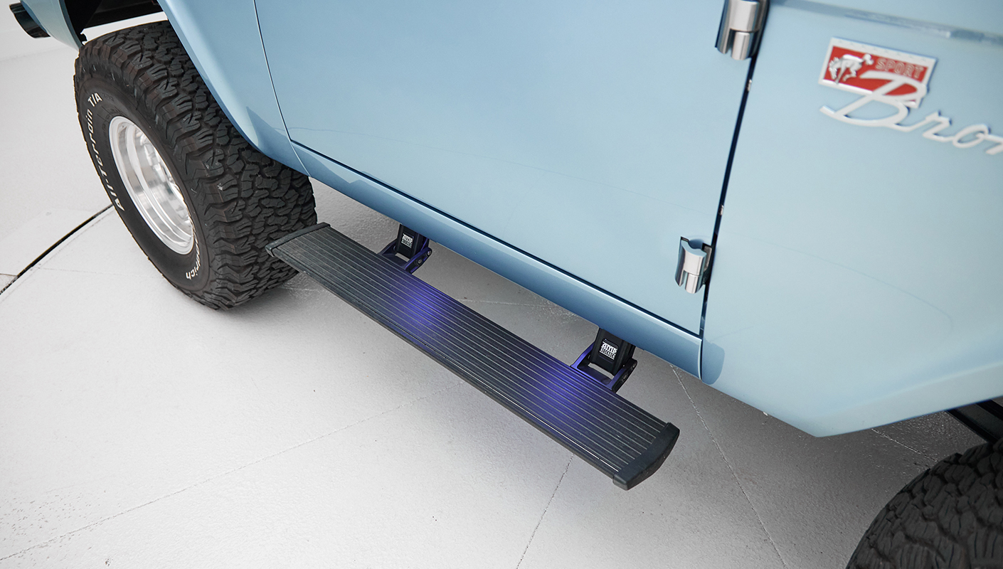 1973 Ford Bronco in Brittany Blue over Whiskey leather power step