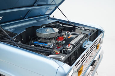 1973 Ford Bronco in Brittany Blue over Whiskey leather engine angle