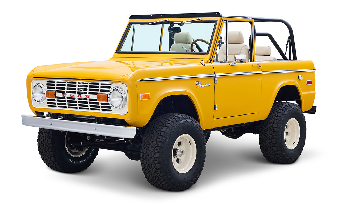 Ford Bronco 1975 in Chrome Yellow with custom Basket Weave Interior and Wimbledon White Wheels