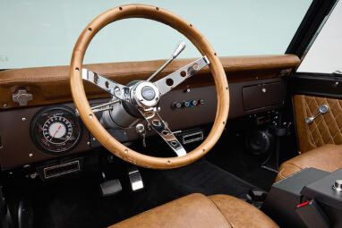 Ford Bronco 1970 in Matte Macadamia Brown with whiskey leather interior and black wheels Wooden Steering Wheel