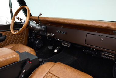 Ford Bronco 1970 in Matte Macadamia Brown with whiskey leather interior and black wheels classic dash