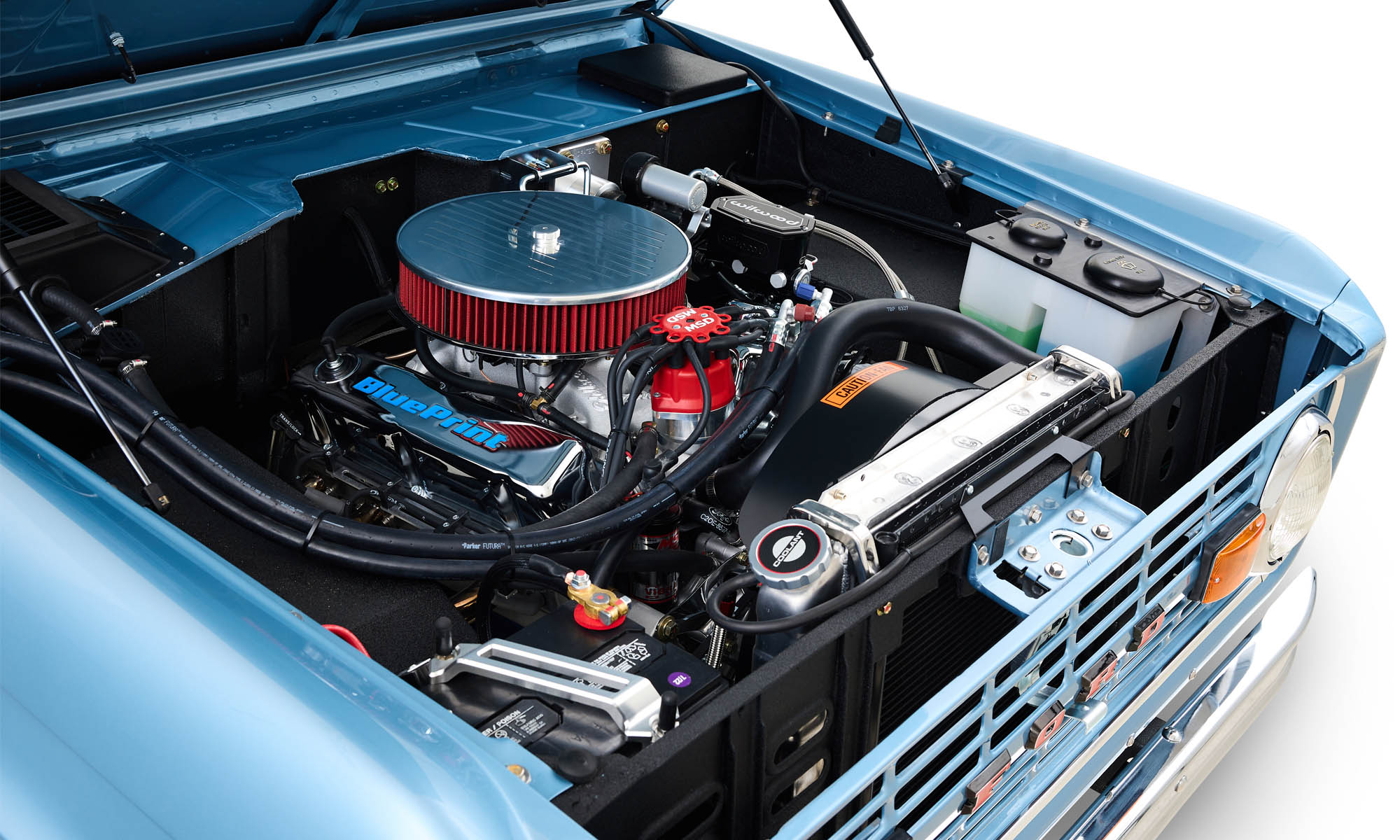 302 crate engine in a Classic Ford Broncos restored Brittany Blue Bronco