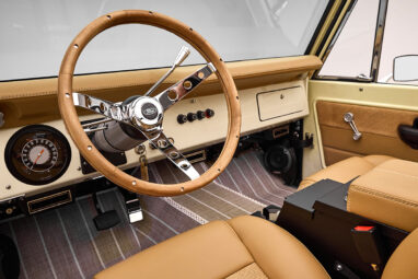 Classic Ford Broncos cab with wood Ford steering wheel