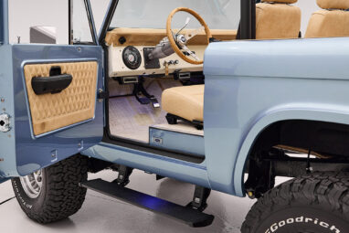 1966 Brittany Blue Classic Ford Bronco with custom diamond stitch interior and factory roll cage