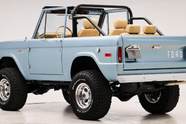 1966 Brittany Blue Classic Ford Bronco with custom diamond stitch interior and factory roll cage