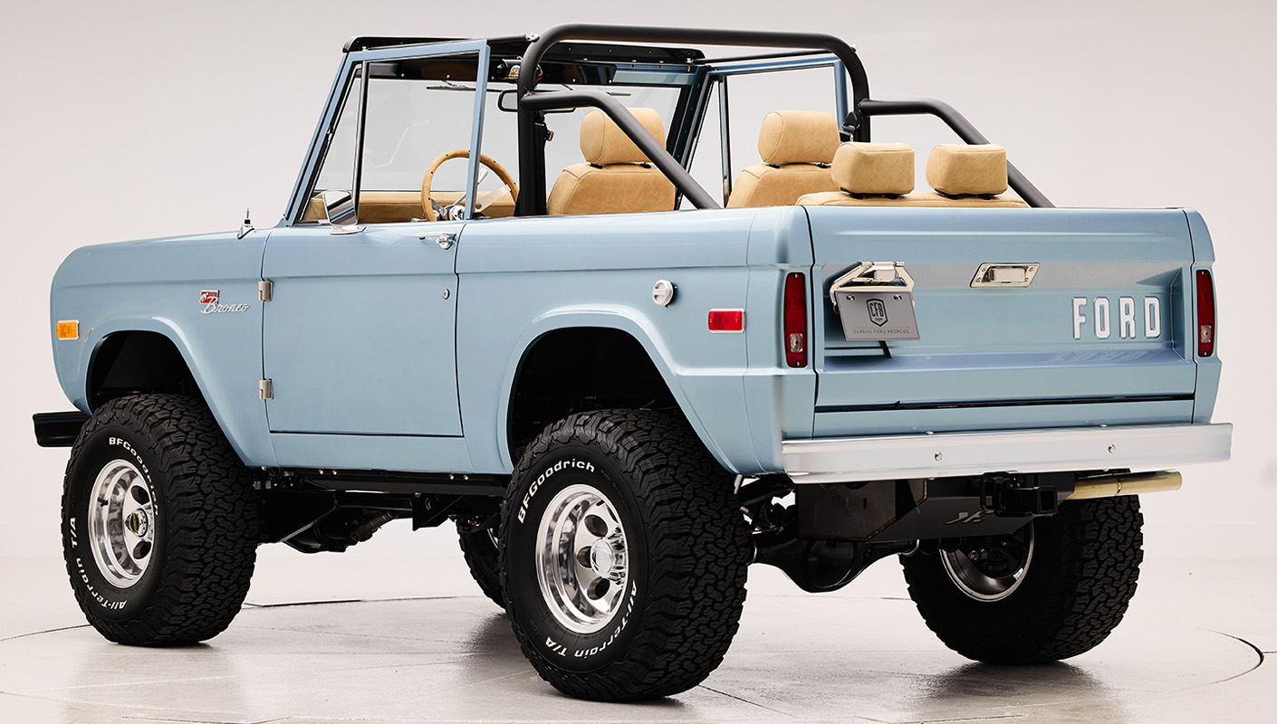 1966 Brittany Blue Classic Ford Bronco with custom diamond stitch interior and factory roll cage