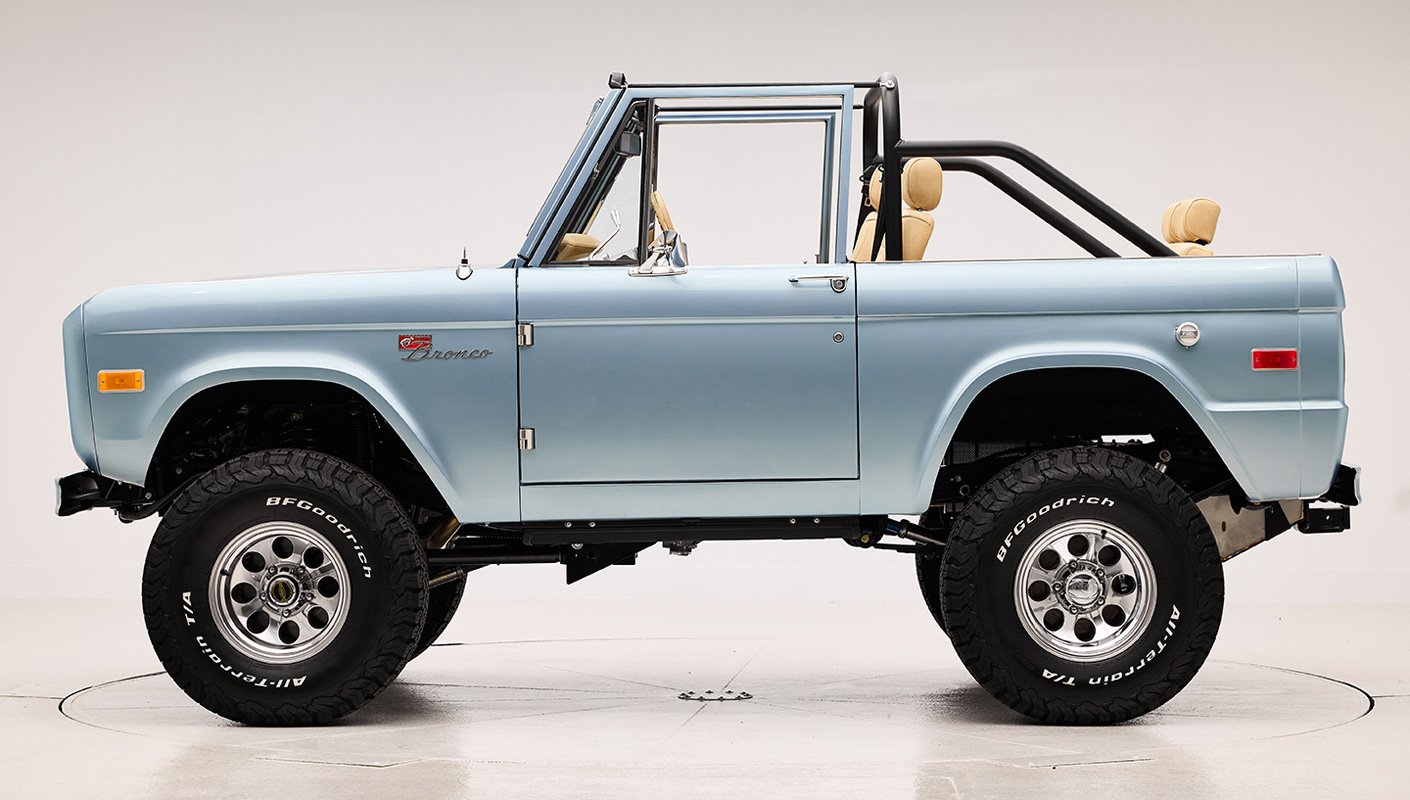 1966 Brittany Blue Classic Ford Bronco with custom diamond stitch interior and factory roll cage