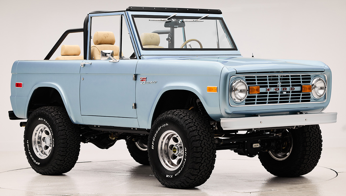 1966 Brittany Blue Classic Ford Bronco with custom diamond stitch interior and factory roll cage