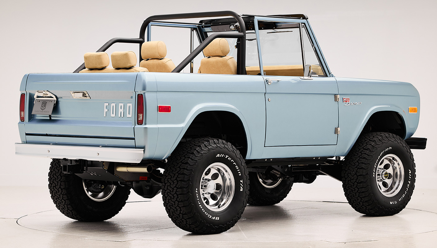 1966 Brittany Blue Classic Ford Bronco with custom diamond stitch interior and factory roll cage