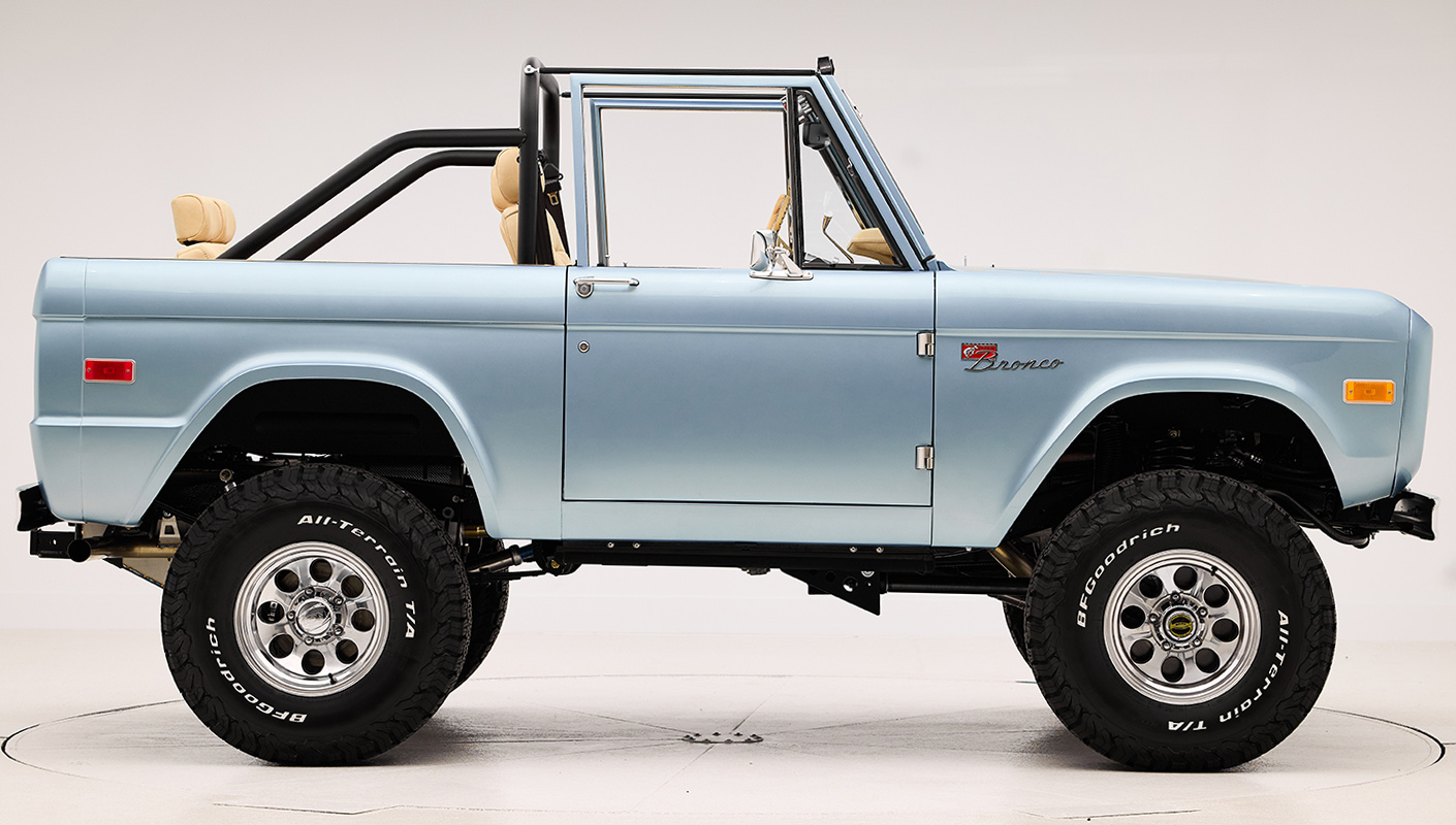 1966 Brittany Blue Classic Ford Bronco with custom diamond stitch interior and factory roll cage