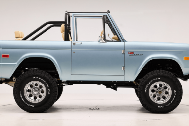 1966 Brittany Blue Classic Ford Bronco with custom diamond stitch interior and factory roll cage