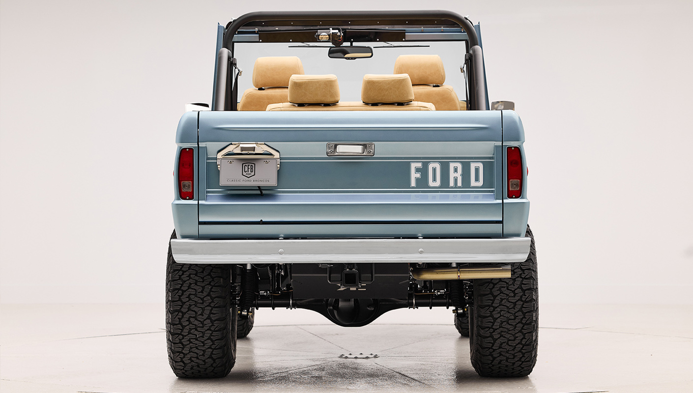 1966 Brittany Blue Classic Ford Bronco with custom diamond stitch interior and factory roll cage