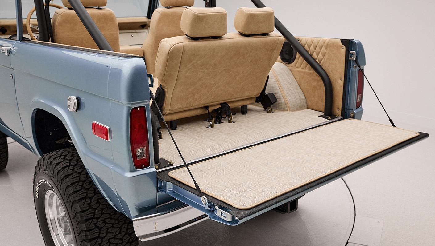 1966 Brittany Blue Classic Ford Bronco with custom diamond stitch interior and custom boat flooring