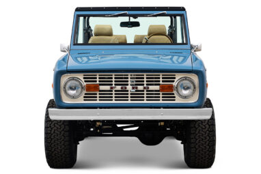 1970 Ford Bronco in Stars and Stripes Blue with family roll cage and Wimbledon White Grille