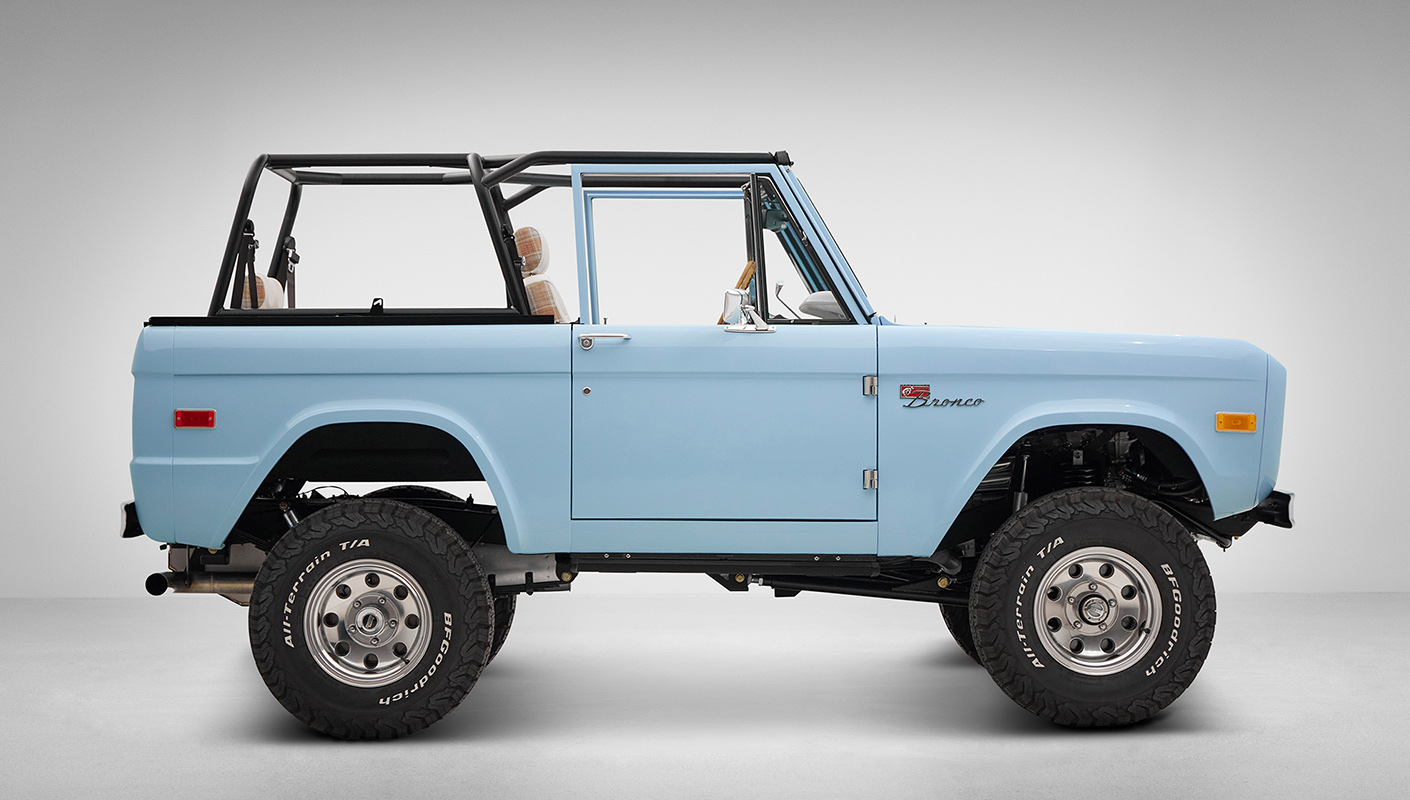 A 1970 Classic Ford Broncos coyote series in frozen blue over custom white rock leather interior, family cage 2 and chrome American racing wheels