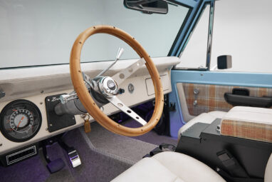 A 1970 Classic Ford Broncos coyote series in frozen blue over custom white rock leather with tartan plaid interior and family cage 2 with wood steering wheel and custom carpet kit