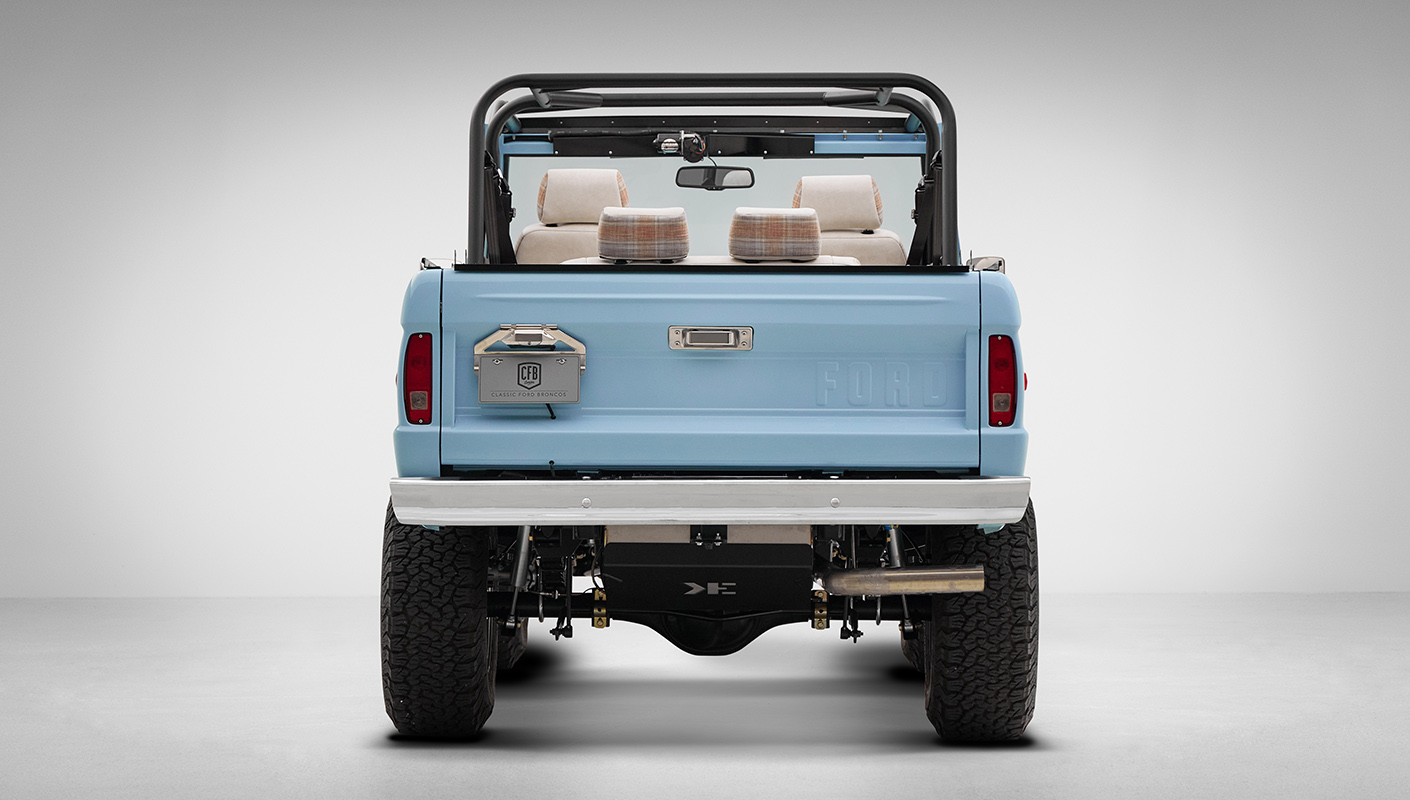 A 1970 Classic Ford Broncos coyote series in frozen blue over custom white rock leather interior, family cage 2, factory chrome bumpers