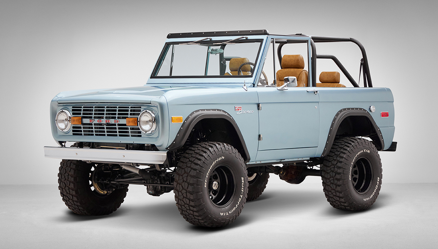 1976 Ford Bronco in Brittany Blue with whiskey diamond stitch driver front angle