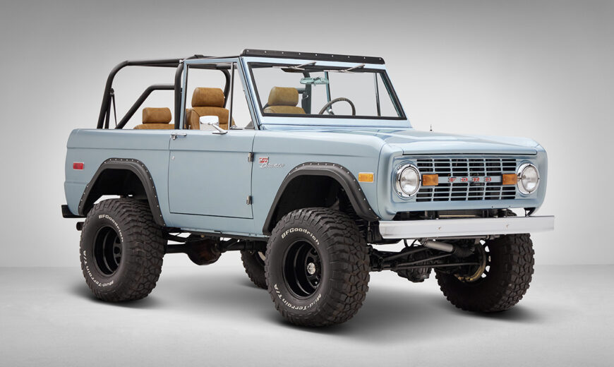 1976 Ford Bronco in Brittany Blue with whiskey diamond stitch front angle