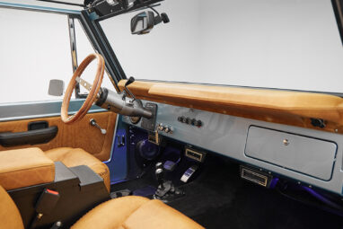1975 ford bronco painted brittany blue with cowboy debossed, baseball stitch leather dash