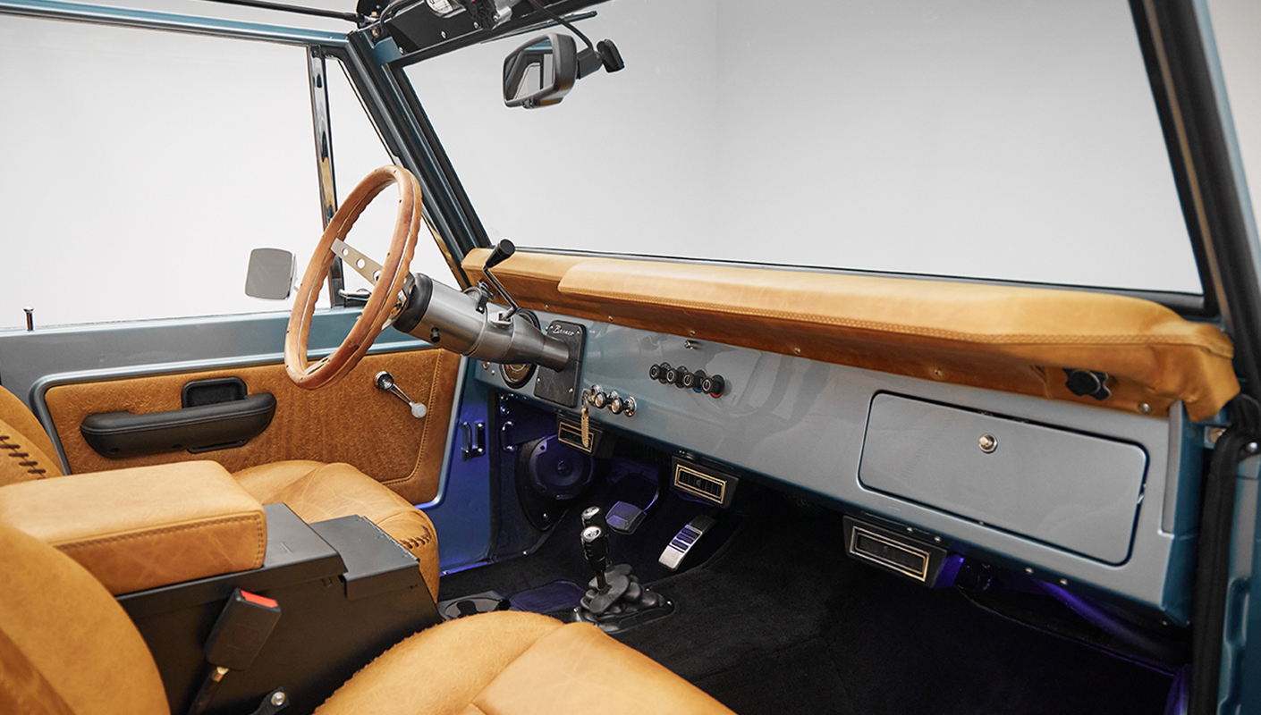 1975 ford bronco painted brittany blue with cowboy debossed, baseball stitch leather dash