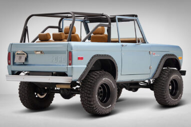 1976 Ford Bronco in Brittany Blue with whiskey diamond stitch passenger rear angle