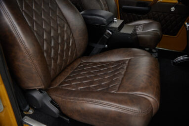 1966 classic ford bronco in goldenrod patina paint with cigar diamond stitch leather seat