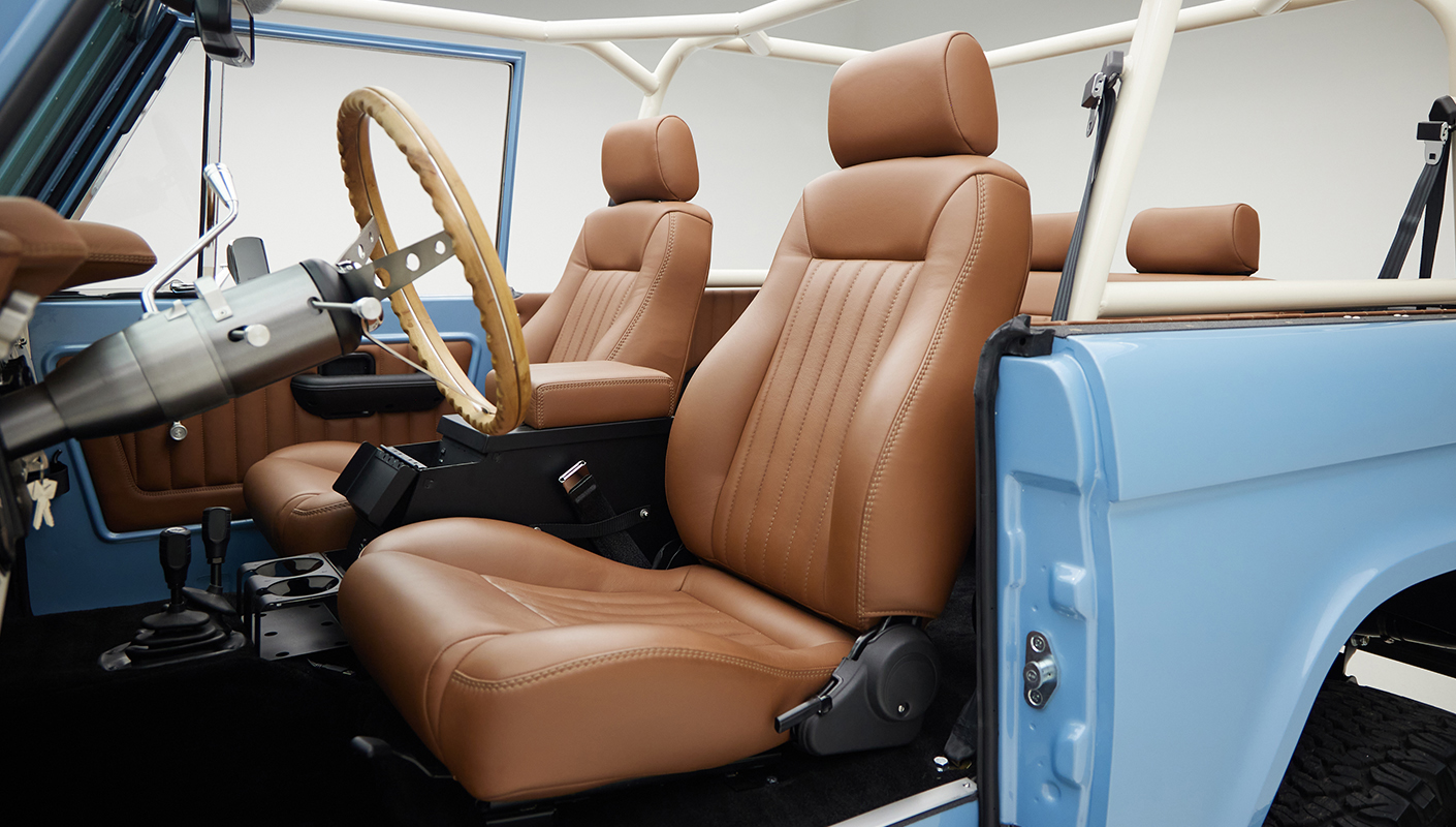 1967 Classic Ford Bronco painted in Frozen Blue over Ball Glove leather interior drivers seat