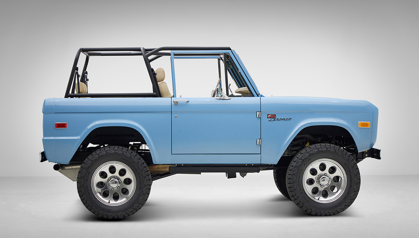 A 1976 Classic Ford Bronco is Frozen Blue over White Rock leather passenger profile
