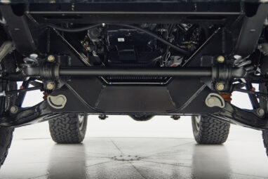 A 1976 Classic Ford Bronco is Frozen Blue over White Rock leather roadster shop chassis independent suspension