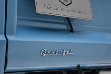 A 1976 Classic Ford Bronco is Frozen Blue over White Rock leather custom grateful dead badge