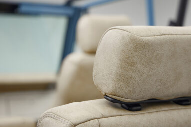 A 1976 Classic Ford Bronco is Frozen Blue over White Rock leather headrests