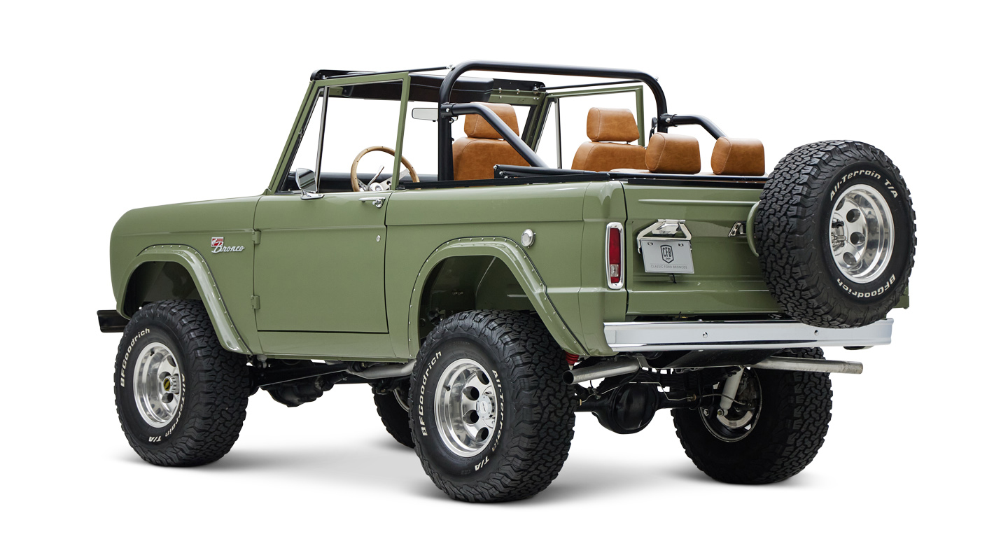 1976 classic ford bronco in boxwood green with ball glove leather driver rear angle