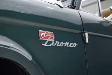 1966 ford bronco in highland green with whiskey leather interior grill