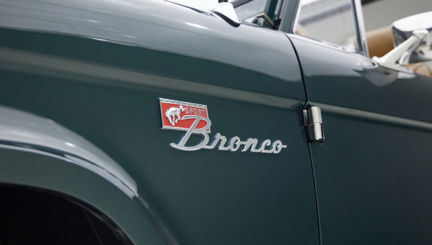 1966 ford bronco in highland green with whiskey leather interior grill