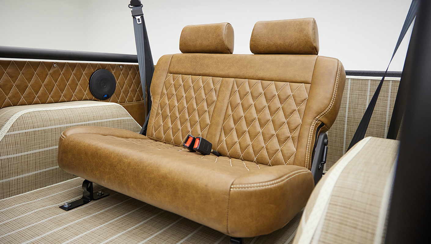 1966 ford bronco in highland green with whiskey leather interior backseat