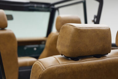 1966 ford bronco in highland green with whiskey leather interior headrests