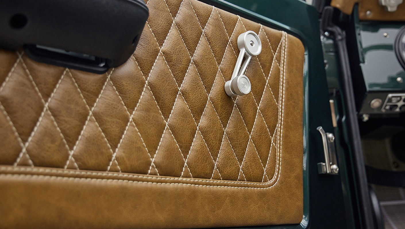 1966 ford bronco in highland green with whiskey leather interior door panel detail