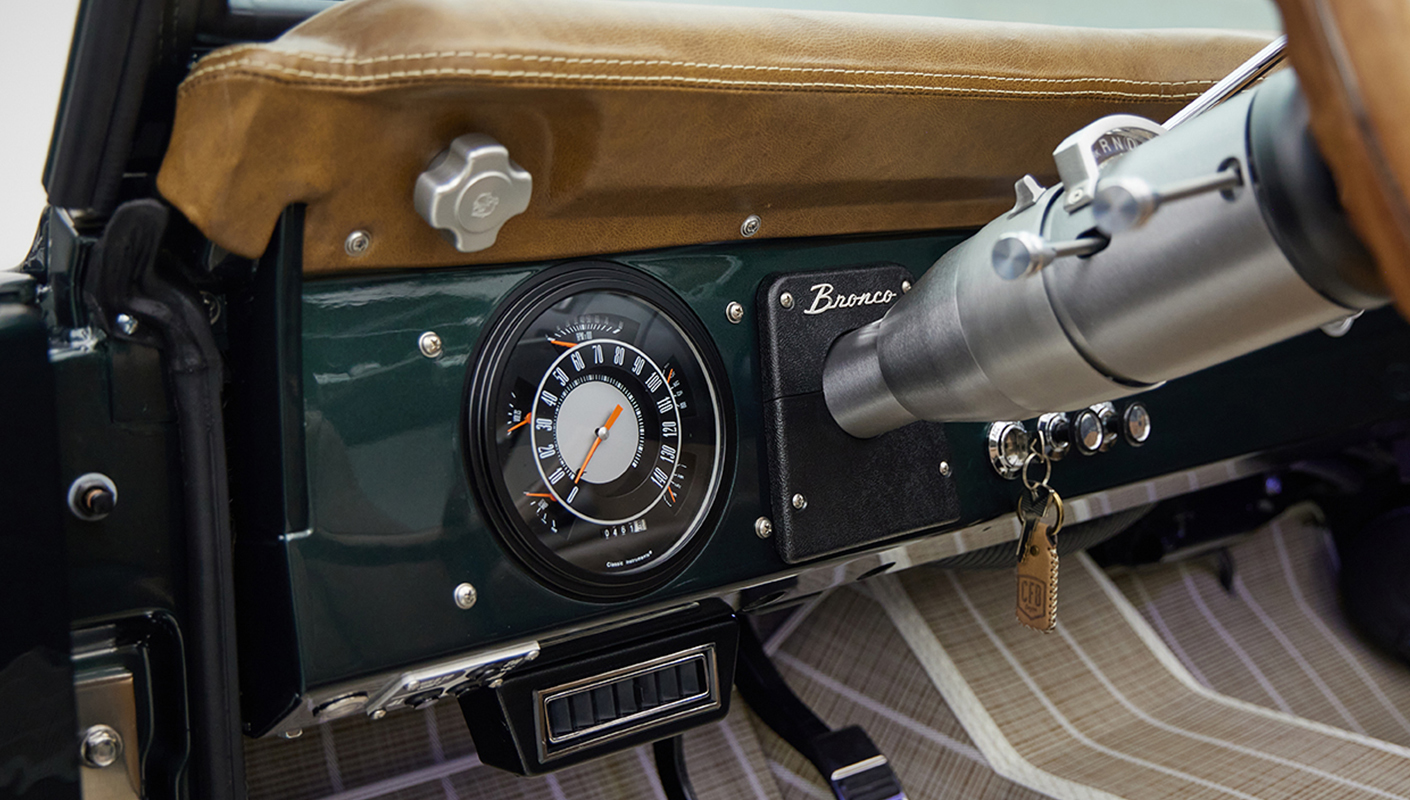 1966 ford bronco in highland green with whiskey leather interior gauge