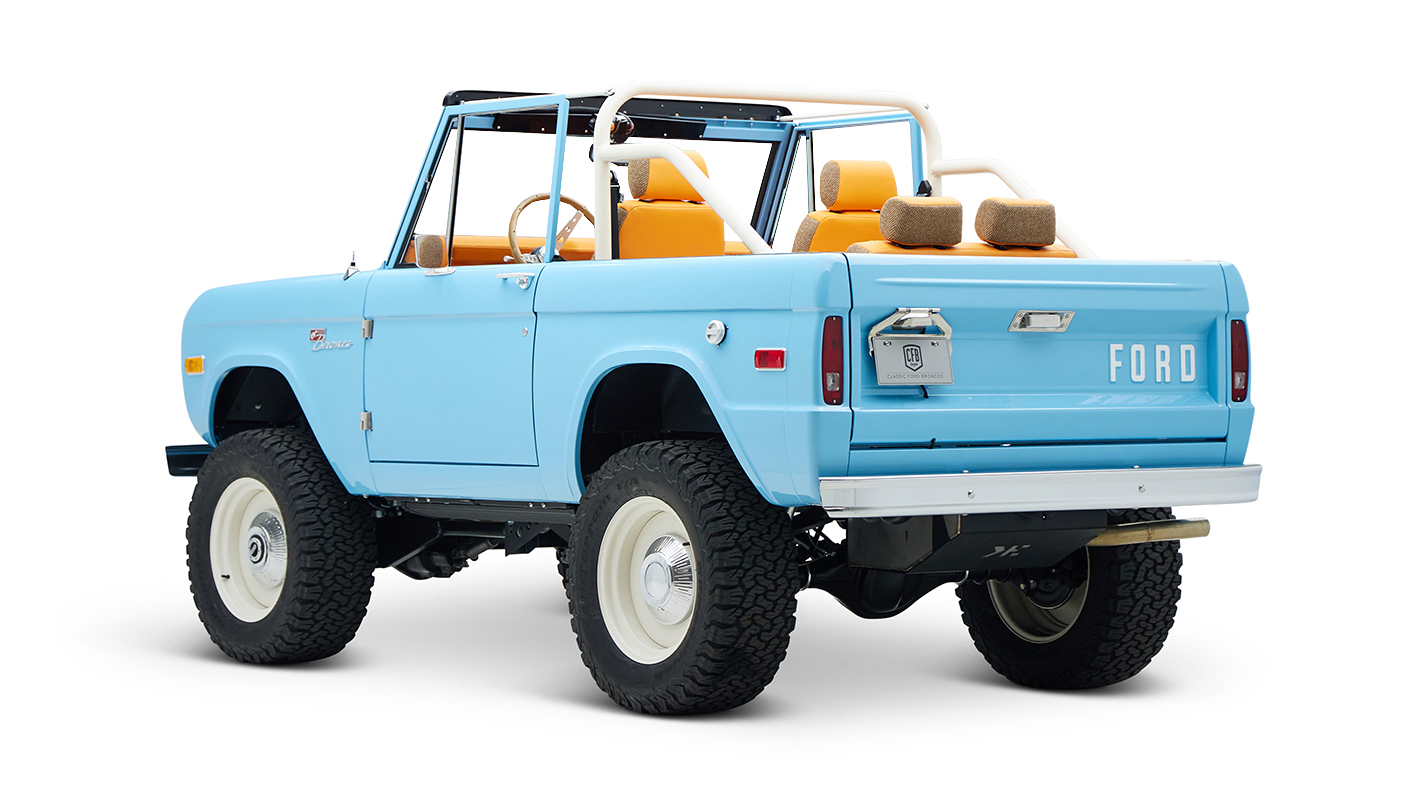 1973 Classic Ford Bronco in frozen blue with rolls royce orange leather and alpaca interior driver rear