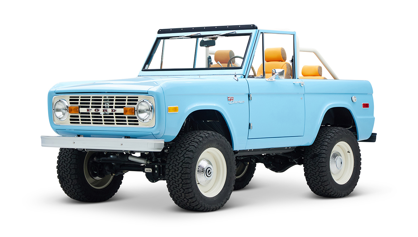 1973 Classic Ford Bronco in frozen blue with rolls royce orange leather and alpaca interior front driver