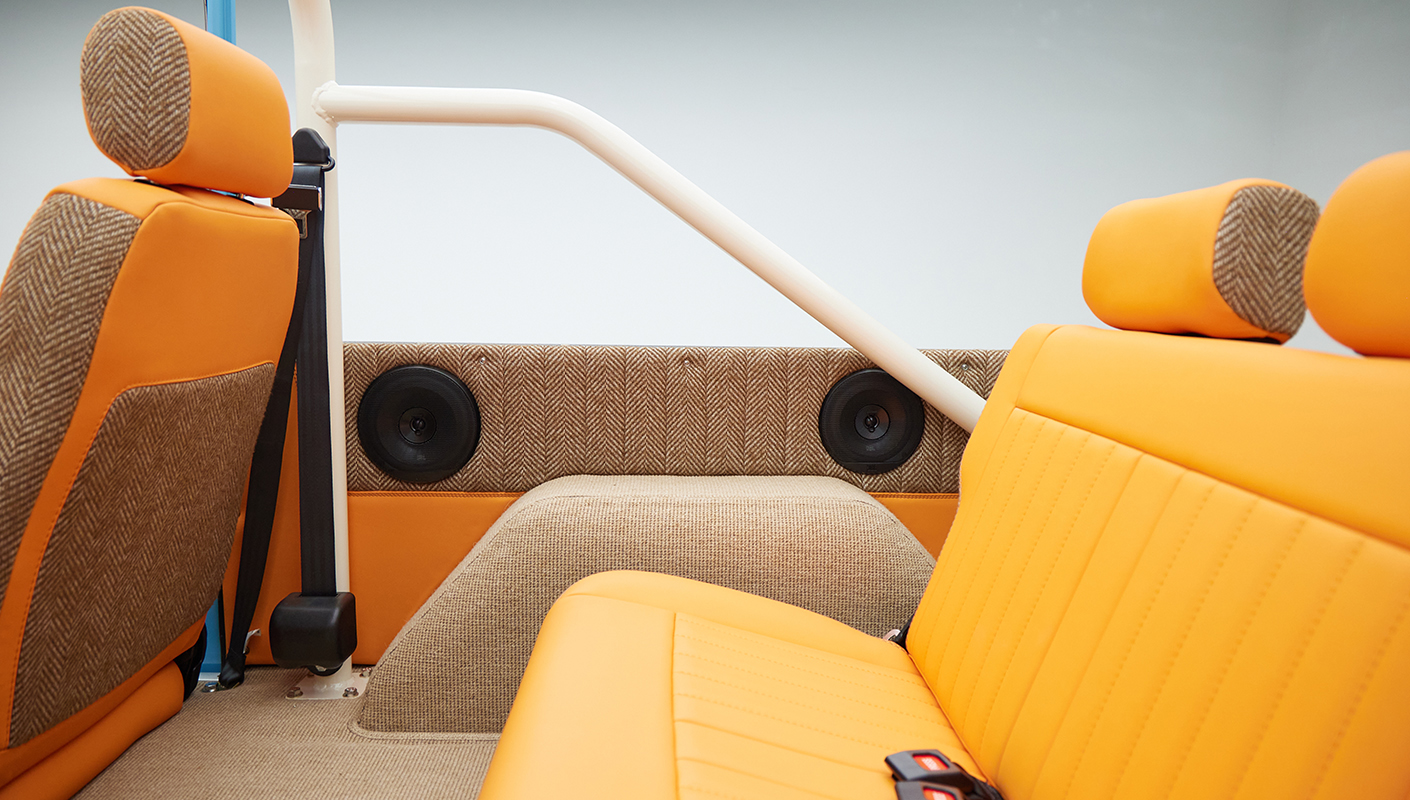 1973 Classic Ford Bronco in frozen blue with rolls royce orange leather and alpaca interior rear speaker panel