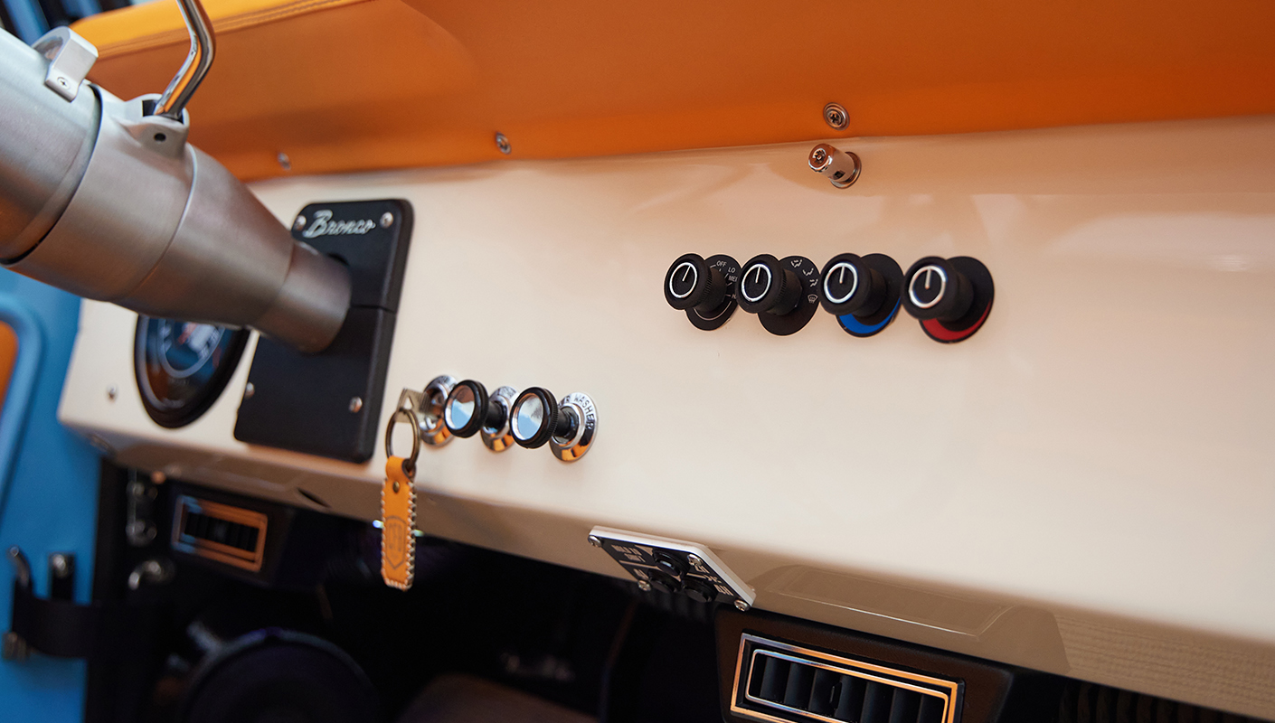 1973 Classic Ford Bronco in frozen blue with rolls royce orange leather and alpaca interior dash