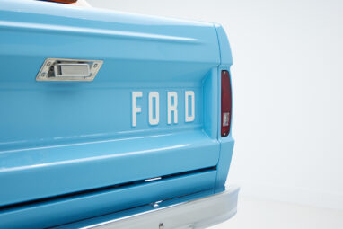 1973 Classic Ford Bronco in frozen blue with rolls royce orange leather and alpaca interior emblem