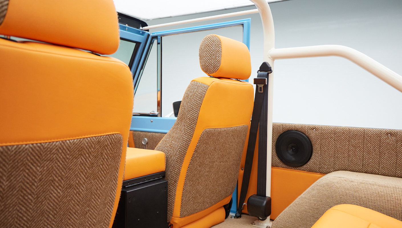 1973 Classic Ford Bronco in frozen blue with rolls royce orange leather and alpaca interior seat detail