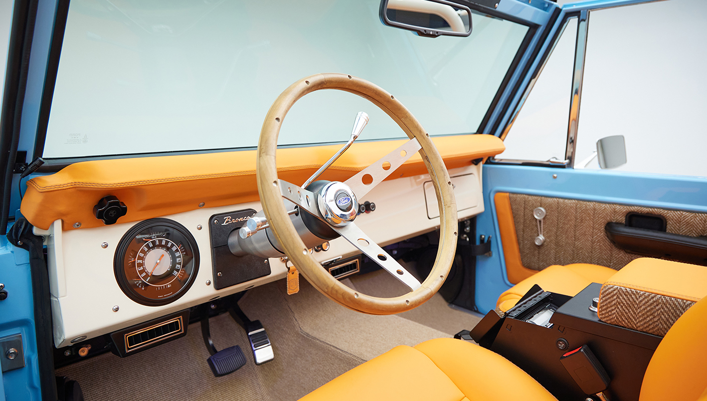 1973 Classic Ford Bronco in frozen blue with rolls royce orange leather and alpaca interior panel