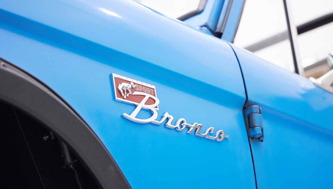 1976 classic ford bronco in blue patina paint with whiskey leather interior emblem