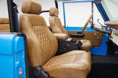 1976 classic ford bronco in blue patina paint with whiskey leather interior passenger seat
