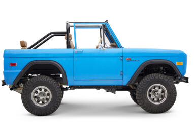 1976 classic ford bronco in blue patina paint with whiskey leather interior passenger profile
